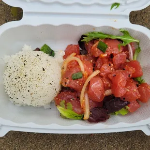 spicy truffle ahi poke with mixed greens and rice