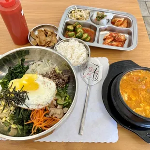 a bowl of soup, a bowl of rice, and a bowl of soup