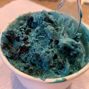 a bowl of ice cream with a spoon in it