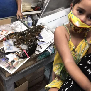 a little girl wearing a face mask