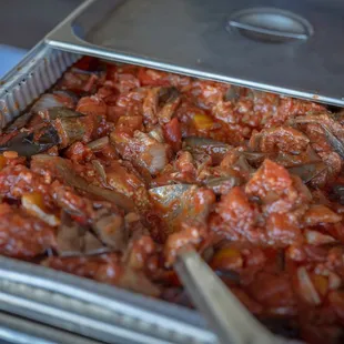 a pan of food with a spoon in it