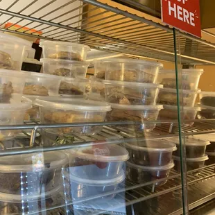 a display case filled with plastic containers