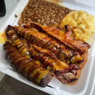 Tender, Smokey and the sauce combination. Holy Moly! What a treat! Homemade Mac ! Spicy but amazingly sweet beans! Sausage medium spice.