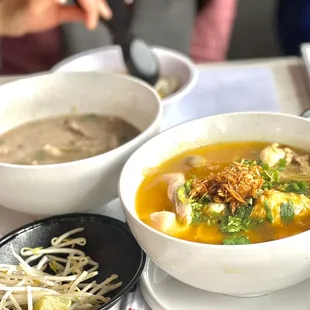 a bowl of soup and a bowl of noodles