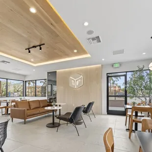 Logo, seating area, interior design