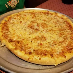 a cheese pizza on a pan