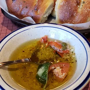 Olive oil,  garlic and basil for dipping the complimentary bread in.