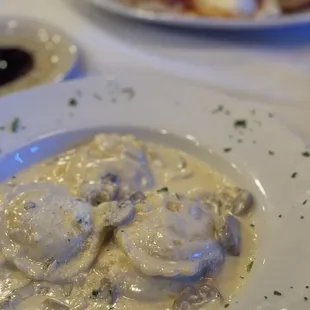 a plate of ravia with meatballs