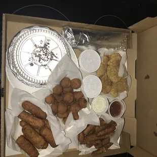 Mozzarella Sticks, zucchini sticks, fried mushrooms, chicken tenders, bacon cheese fries and cheesy garlic bread.