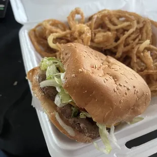 Fully dressed cheeseburger with onion rings