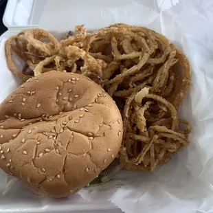 a hamburger and onion rings