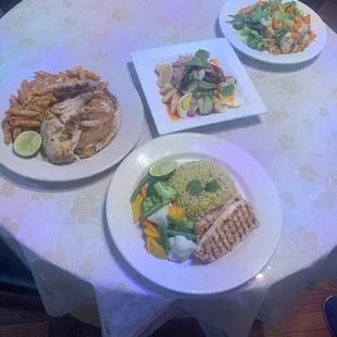 three plates of food on a table