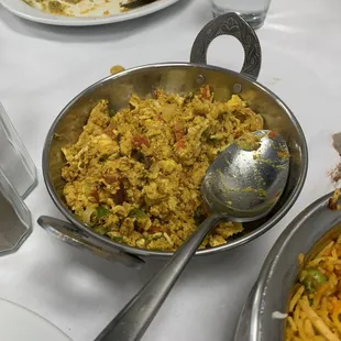 a bowl of rice and a plate of food