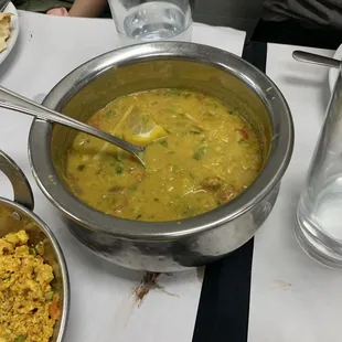 a bowl of soup and a bowl of rice