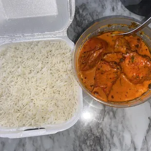 a bowl of rice and a container of chicken curry