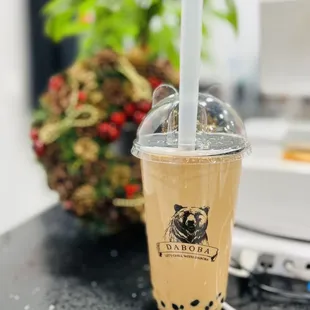 a cup of bubble tea on a table