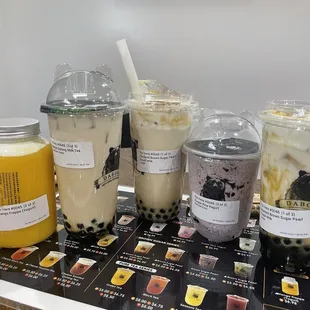 Mango frappe, two of the roasted brown sugar milk tea, purple rice yogurt, and salted cheese season tea.