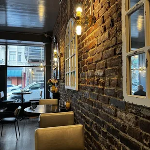 a brick wall and tables