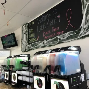 a row of dispensers on a counter