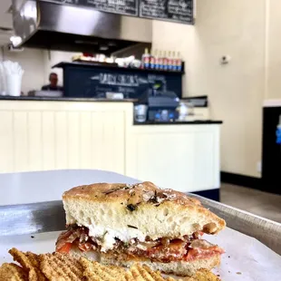 a plate of chips and a sandwich