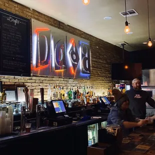 a man and a woman at a bar