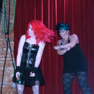 a man and a woman dressed in latex