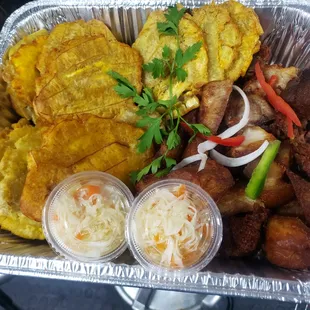 Fried pork/ Griyo  plaintain, pikliz