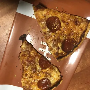 two slices of pizza on a plate