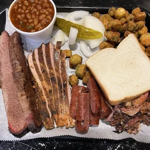 4 meat (sliced beef, smoked chicken, pulled pork, and hot links)shareable with side of baked beans and fried okra
