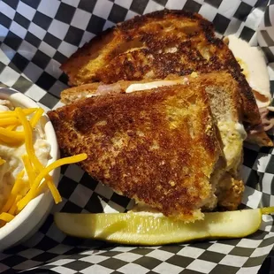 a grilled cheese sandwich with a side of potato salad