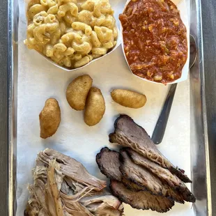 Two meat platter - brisket, pulled pork, Brunswick Stew (don&apos;t ask, just order it!), mac and cheese, and hush puppies.