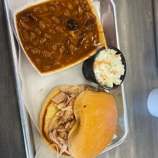 a pulled pork sandwich and coleslaw