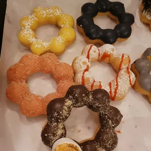 Smores, strawberries shortcake, funnel cake, ube, and lemon bar mochi donuts