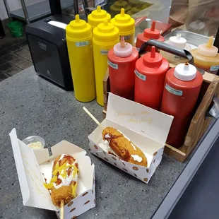 Sauce selection for in-store use and a pretty non-photogenic pair of dogs after I applied the sauces