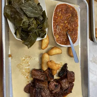 Beef burnt tips with Brunswick stew, collards and hush puppies