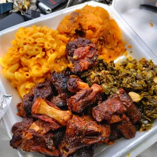 Dr Pepper oxtails, Mac and cheese, collard greens with yams. This is called THE SOUL FOOD BOX $30