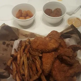 Wing basket with corn fritters a d boudain balls