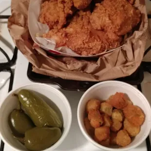 The Saturday special a whole chicken, with fries, peppers, and pickles and a side of fried okra. Crispy... Succulent... Well seasoned...