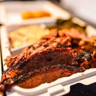 a tray of meat and vegetables