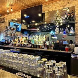 a bar filled with glasses