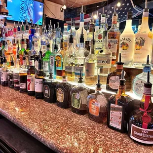 a bar filled with liquor bottles