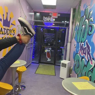 a person sitting on a stool