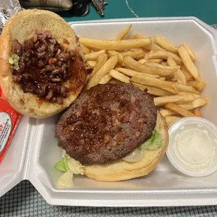 A bbq bacon burger with a side of fries