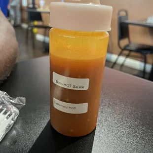 House made spicy hot sauce. Try it if you dare!!!