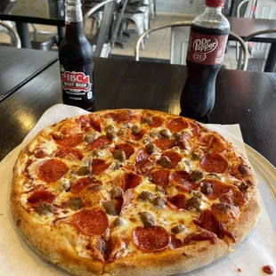 Large pepperoni pizza with italian sausage