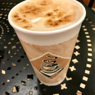 a cup of coffee on a table