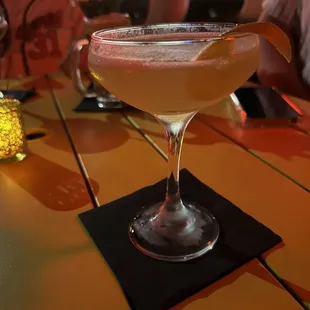 a drink in a glass on a table