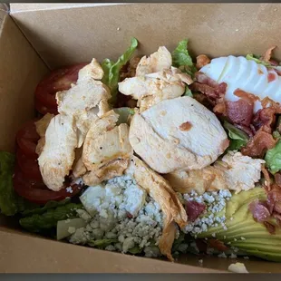 Cobb Salad, this was taken in 2021 when the quality was MUCH better. (Now chicken is cubed, premade)