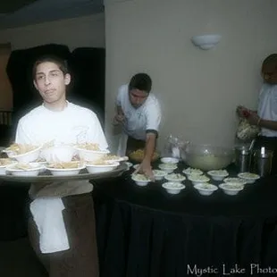 bus boys setting salsa and chips on tables