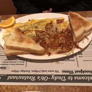 Veggie omelette with bacon added, hash browns and toast.
